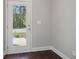 Front entry door with glass panel offering natural light and view of the yard at 3136-B Brownstone Se Ln, Atlanta, GA 30354