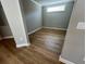 Finished basement area with neutral paint and wood floors throughout the space at 3587 Fishpond Cir, Dacula, GA 30019