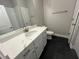 Bathroom with sleek white vanity, quartz countertop, and modern fixtures at 3587 Fishpond Cir, Dacula, GA 30019