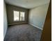 Cozy bedroom featuring neutral carpet and ample natural light at 3587 Fishpond Cir, Dacula, GA 30019