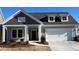 Charming single-Gathering home featuring a two-car garage and meticulously landscaped front yard at 3587 Fishpond Cir, Dacula, GA 30019