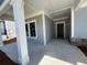 Welcoming front porch featuring a gray-toned entrance with stone accents on the adjacent wall at 3587 Fishpond Cir, Dacula, GA 30019