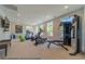 Well-equipped gym featuring modern treadmills, elliptical machines, and weightlifting equipment at 3587 Fishpond Cir, Dacula, GA 30019