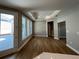 Sunlit living room boasts hardwood floors and views of the backyard at 3587 Fishpond Cir, Dacula, GA 30019