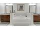 Elegant bathroom with a soaking tub, granite countertops, dual sinks, and modern fixtures at 3621 Vinings Slope Se # 3411, Atlanta, GA 30339
