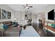 Open-concept living room connected to the kitchen and dining area, perfect for entertaining at 3621 Vinings Slope Se # 3411, Atlanta, GA 30339