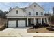 Charming two-story home features a two-car garage, covered porch, and beautiful stone accents at 337 Willow Cv, Canton, GA 30114
