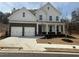 Charming two-story home with a stone facade and attached two-car garage at 337 Willow Cv, Canton, GA 30114