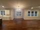 Open-concept living and dining area featuring hardwood floors and natural light at 337 Willow Cv, Canton, GA 30114
