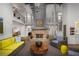 Two-story living room with a stone fireplace, a large sofa, an open floor plan and natural light at 337 Willow Cv, Canton, GA 30114