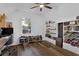 Bright bedroom featuring built-in shelving, a window, and hardwood floors at 751 San Fernando Se Dr, Smyrna, GA 30080