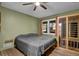 Cozy bedroom with neutral walls, wood floors and a window letting in natural light at 751 San Fernando Se Dr, Smyrna, GA 30080