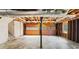 Spacious unfinished basement with a two-car garage entrance and utilities present at 211 Murphy Ave, Lawrenceville, GA 30044