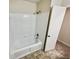 Clean and bright bathroom with shower and tub combo plus convenient linen closet at 211 Murphy Ave, Lawrenceville, GA 30044