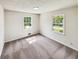 Inviting bedroom featuring two windows for natural light and hardwood floors at 211 Murphy Ave, Lawrenceville, GA 30044