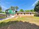 Charming two-story home featuring a well-maintained front yard and an attached two-car garage at 211 Murphy Ave, Lawrenceville, GA 30044