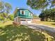 Attached two-car garage with a large driveway and yard space at 211 Murphy Ave, Lawrenceville, GA 30044