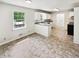 Sunlit kitchen with granite countertops and white cabinetry at 211 Murphy Ave, Lawrenceville, GA 30044