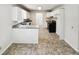 Bright kitchen features white cabinets, black appliances and granite countertops at 211 Murphy Ave, Lawrenceville, GA 30044