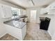 Bright kitchen features granite counters, white cabinets, and stainless steel appliances at 211 Murphy Ave, Lawrenceville, GA 30044