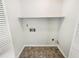 Small laundry room with overhead shelf at 211 Murphy Ave, Lawrenceville, GA 30044