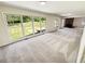 Spacious living room featuring a neutral paint, fireplace, and plenty of light at 211 Murphy Ave, Lawrenceville, GA 30044