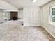 Versatile living room with carpeted flooring, fireplace, closet and access to the outdoors at 211 Murphy Ave, Lawrenceville, GA 30044