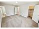 Spacious main bedroom featuring new carpet, closet and ensuite bath at 211 Murphy Ave, Lawrenceville, GA 30044