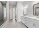 Elegant bathroom with double sink vanity, tiled floors, and a glass-enclosed shower at 482 Broom Dr, Cumming, GA 30040