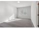 Bright, carpeted bedroom with large window providing natural light and neutral walls at 482 Broom Dr, Cumming, GA 30040