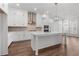 Bright kitchen with white cabinets, stainless steel appliances, a center island, and a stylish backsplash at 482 Broom Dr, Cumming, GA 30040