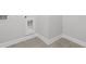 The clean and simple laundry room has ample space for appliances and storage at 482 Broom Dr, Cumming, GA 30040