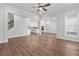 Spacious living room with an open floor plan that flows into the kitchen, complete with wood flooring at 482 Broom Dr, Cumming, GA 30040