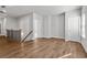 Open loft area with hardwood floors and a staircase with a decorative railing at 482 Broom Dr, Cumming, GA 30040