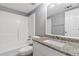 Clean bathroom with shower/tub combo, granite vanity and neutral walls at 1055 Leighs Brook Way, Dacula, GA 30019