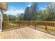 Wooden deck with backyard view and wooden railings at 1055 Leighs Brook Way, Dacula, GA 30019