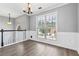 Bright dining room with hardwood floors and large window at 1055 Leighs Brook Way, Dacula, GA 30019