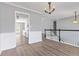 Open dining room with view into kitchen and hardwood floors at 1055 Leighs Brook Way, Dacula, GA 30019