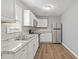 Kitchen with white cabinets, stainless steel appliances, and granite countertops at 1055 Leighs Brook Way, Dacula, GA 30019