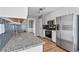 Kitchen with granite countertops and stainless steel appliances at 1055 Leighs Brook Way, Dacula, GA 30019
