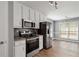 Kitchen with granite countertops and stainless steel appliances at 1055 Leighs Brook Way, Dacula, GA 30019