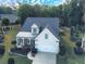 Aerial view of a home showcasing the front yard and tree coverage at 3406 Ravensworth Nw Trce, Kennesaw, GA 30144