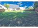 Fenced backyard with healthy grass, an outbuilding, and an enclosed porch at 3406 Ravensworth Nw Trce, Kennesaw, GA 30144