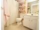 Bright bathroom featuring floating shelves, tile floors and a walk-in shower at 3406 Ravensworth Nw Trce, Kennesaw, GA 30144