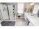 Bright bathroom featuring a glass-enclosed shower and double sink vanity with ample counter space at 3406 Ravensworth Nw Trce, Kennesaw, GA 30144