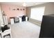 Bright bedroom used as an office space with built-in desks and neutral carpet at 3406 Ravensworth Nw Trce, Kennesaw, GA 30144