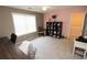 Cozy bedroom with a ceiling fan, large window and pink accent wall at 3406 Ravensworth Nw Trce, Kennesaw, GA 30144