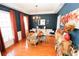 Cozy dining room with dark blue walls, hardwood floors, and elegant chandelier, perfect for entertaining at 3406 Ravensworth Nw Trce, Kennesaw, GA 30144