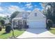 Charming home featuring a well-manicured lawn and inviting front porch at 3406 Ravensworth Nw Trce, Kennesaw, GA 30144
