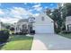 Inviting home showcasing a well-kept lawn and a welcoming covered porch at 3406 Ravensworth Nw Trce, Kennesaw, GA 30144